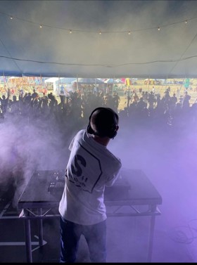 Max Dolan, Notts teenager DJ-ing at festival in front of crowd