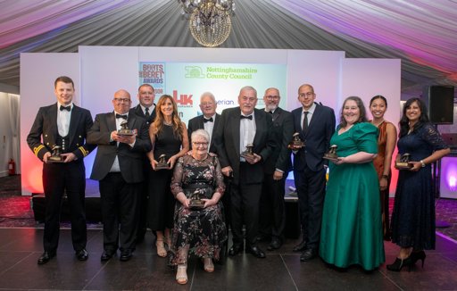 All the winners from 2024 Boots and Beret awards gather for a photo on the presentation stage. The event was held in a stylishly decorated, gala tent at Goosedale, Nottingham.